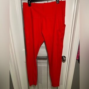 Red active wear leggings with side pockets